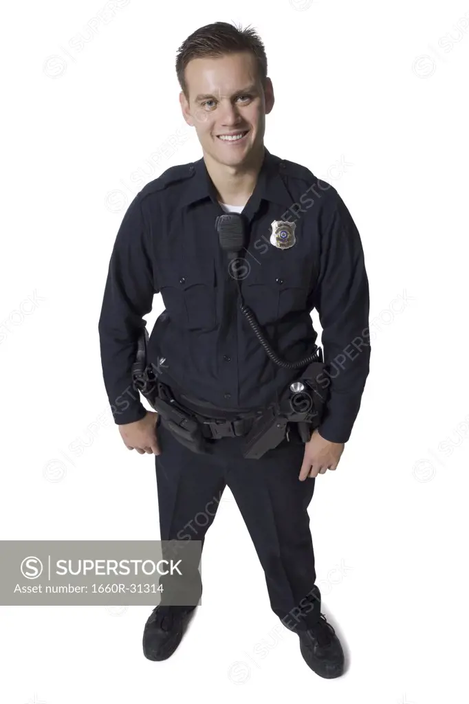 Male police officer standing with arms crossed smiling