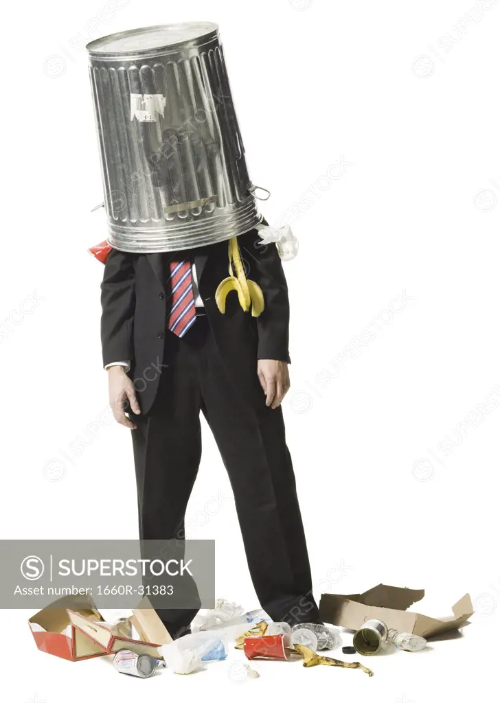 Businessman with trash can on head