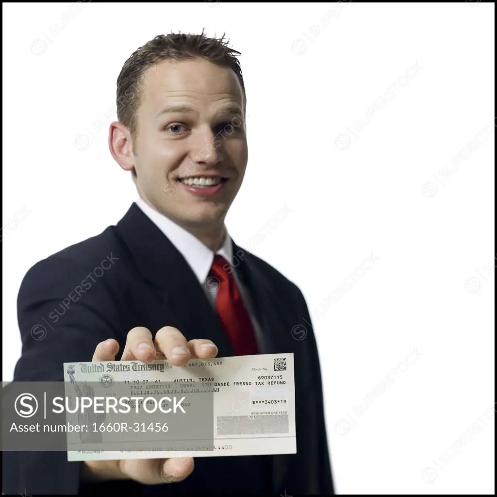 Businessman holding US Treasury check