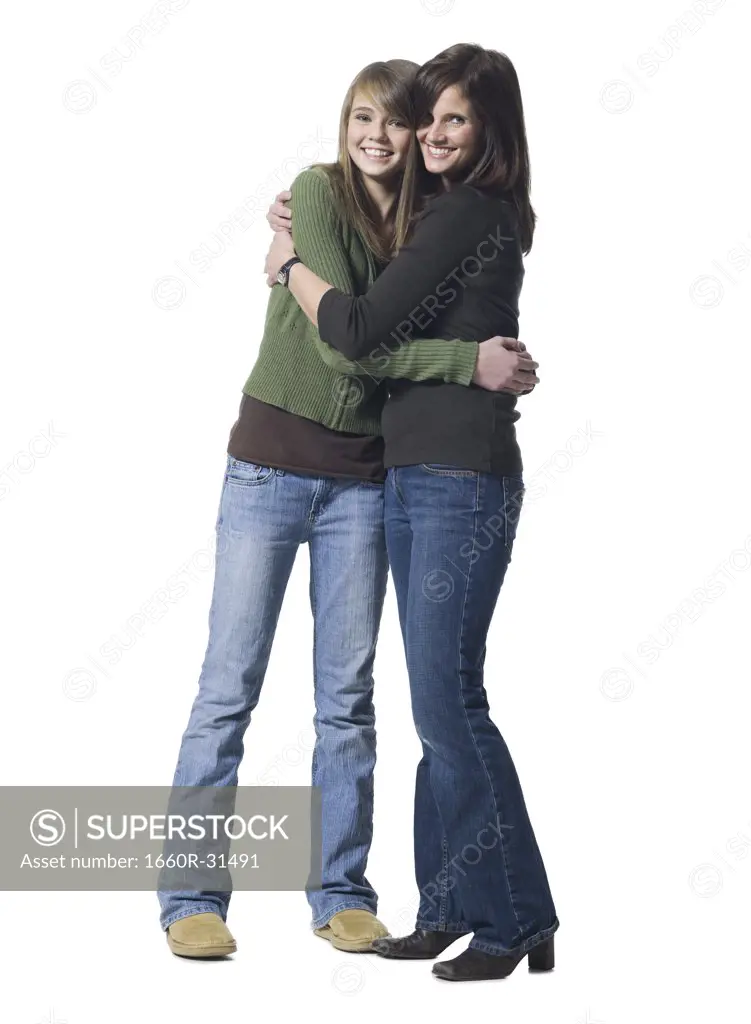 Woman and girl embracing