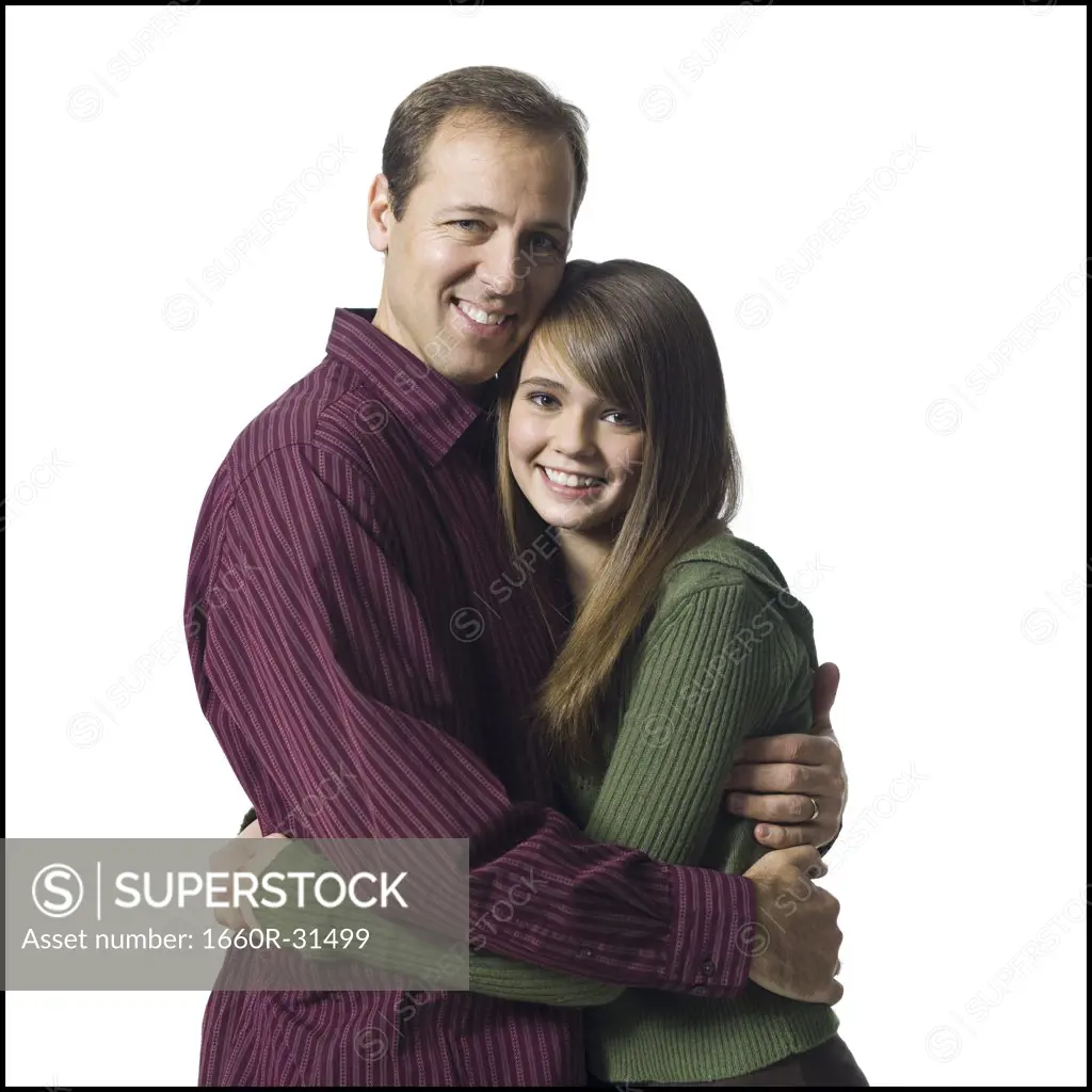 Man and girl embracing