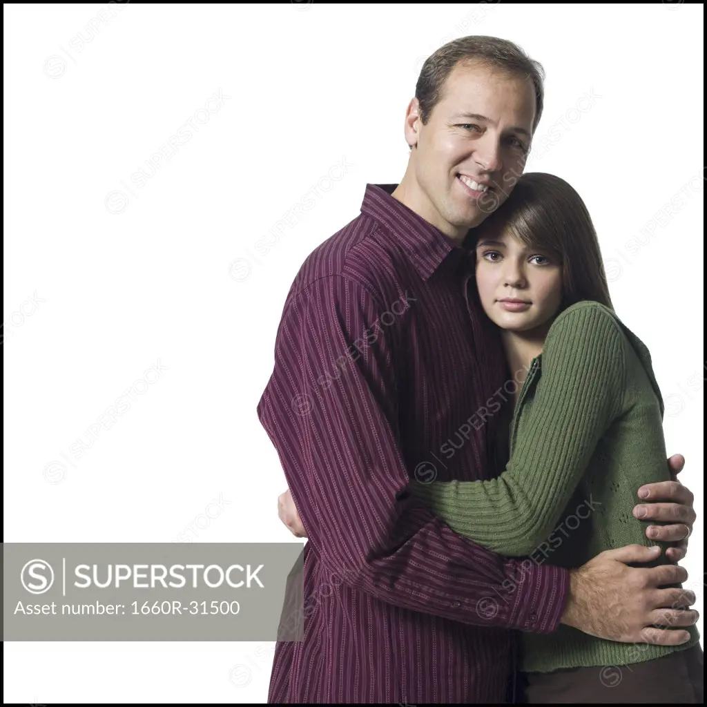 Man and girl embracing