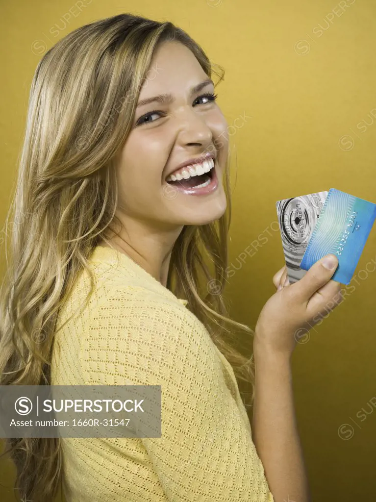 Woman smiling with credit cards