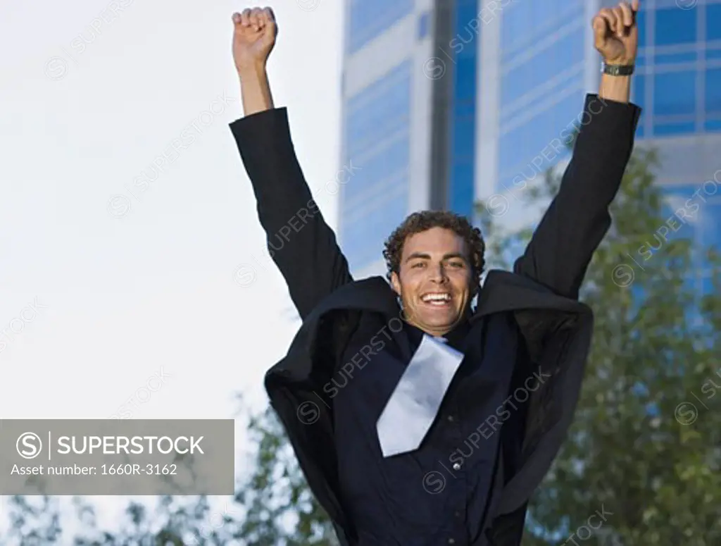 Portrait of a businessman jumping up