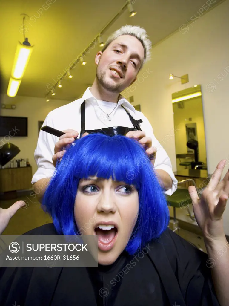Young woman at hair salon with blue hair