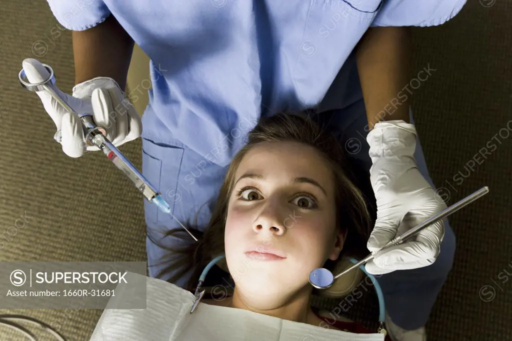 Girl having dental examination