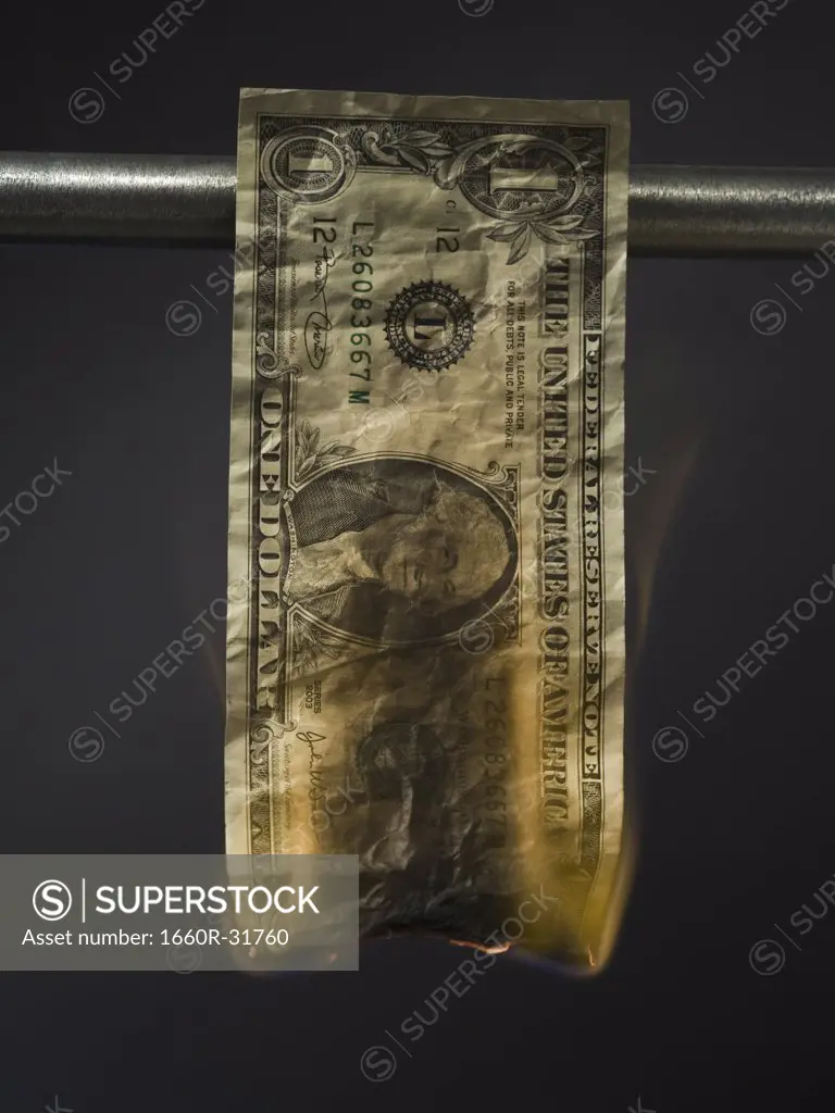 United States one dollar bill on fire