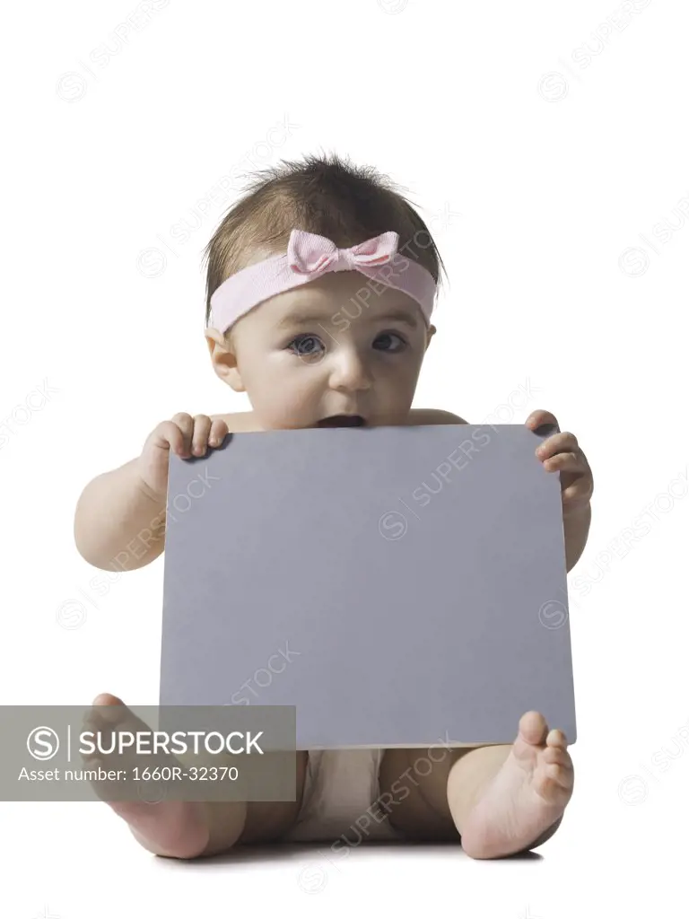 Baby girl with blank sign