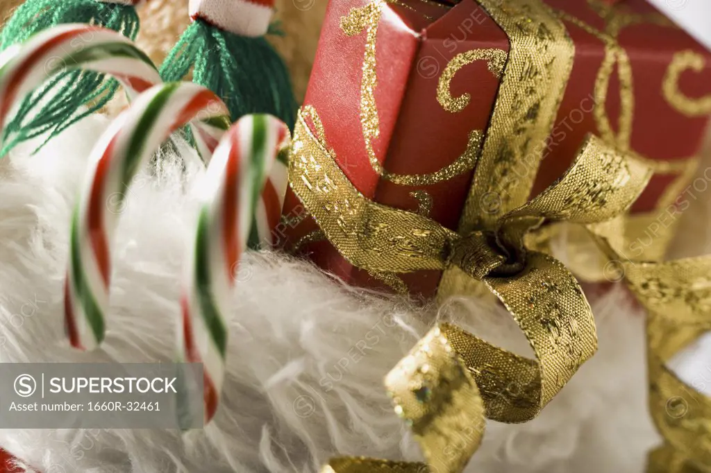 Closeup of Christmas stocking with candy canes and ribbon