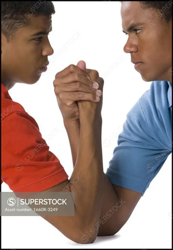 Close-up of two young men arm wrestling