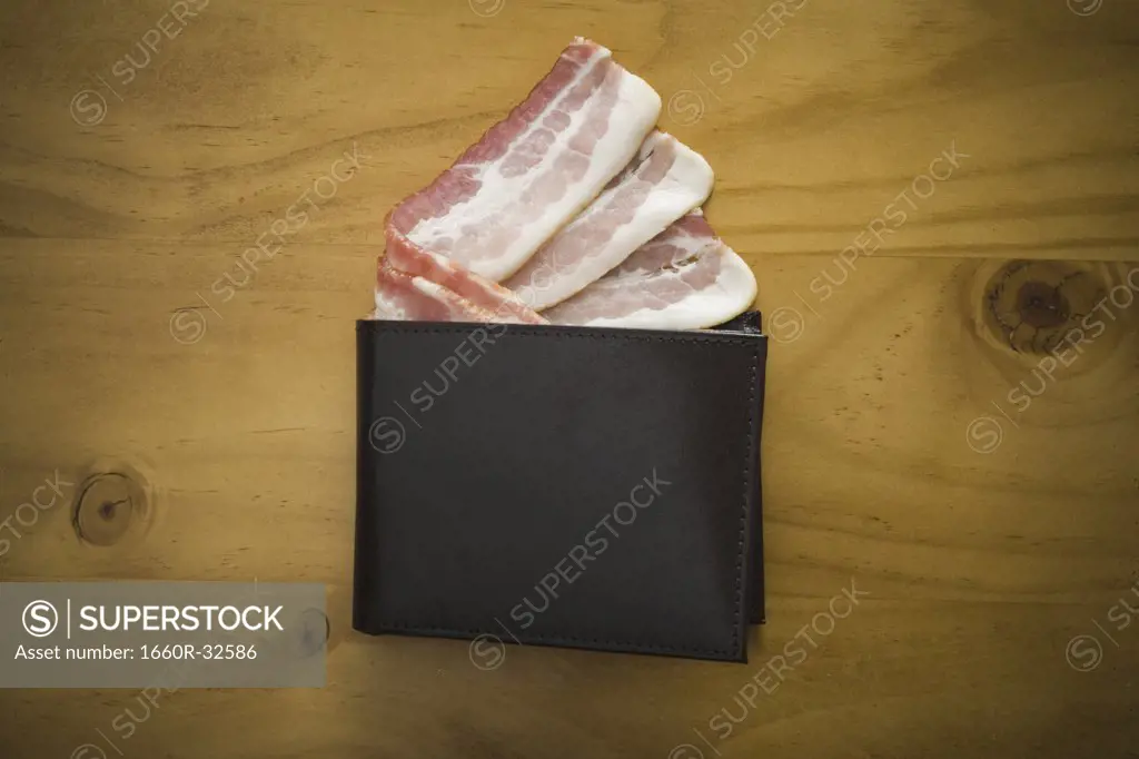 Billfold with strips of bacon