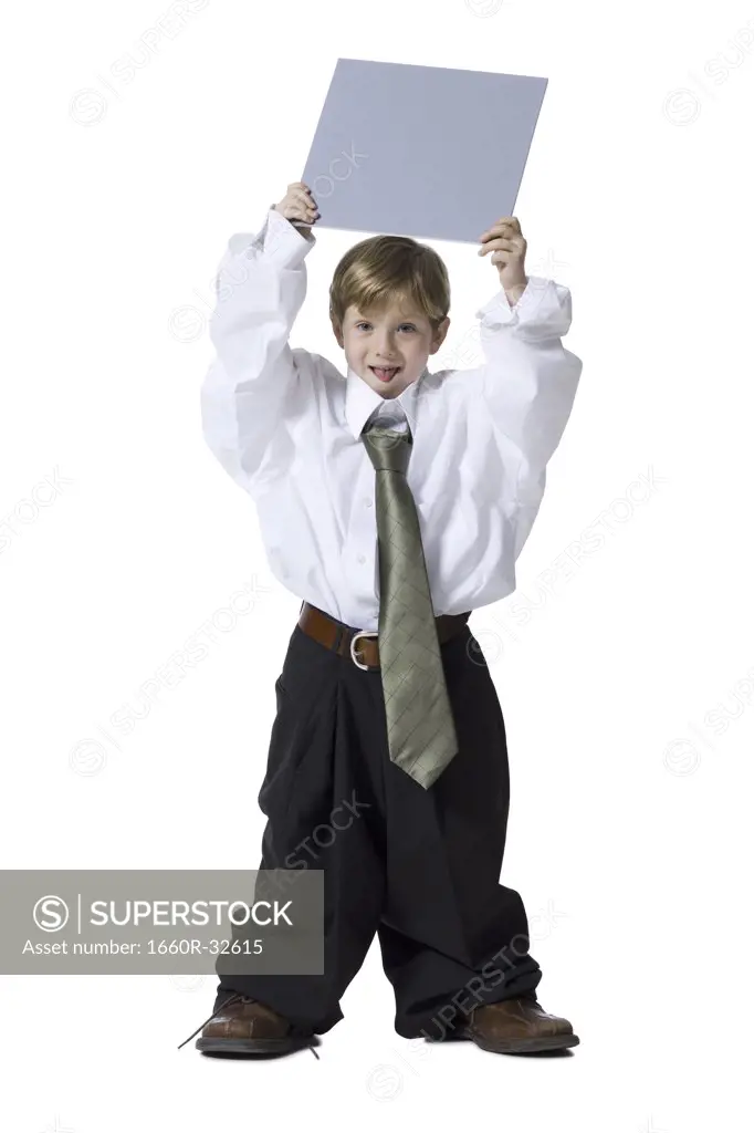 Little boy dressed as business executive with blank sign