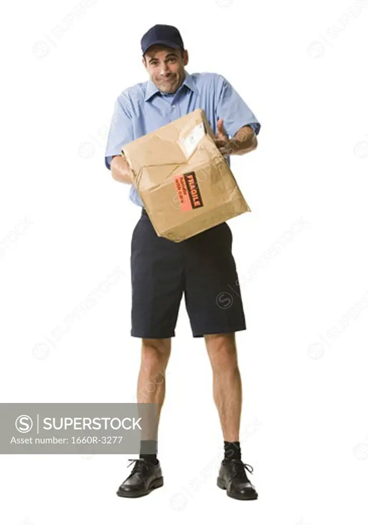 Portrait of a mailman holding a damaged package