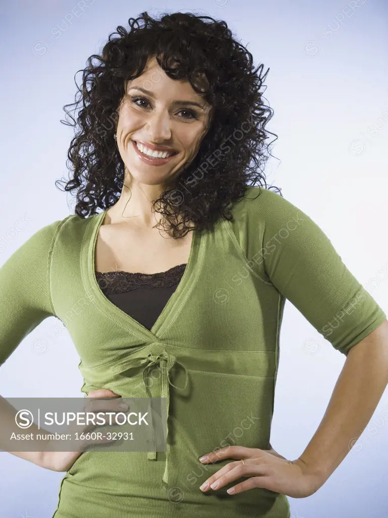 Woman standing and smiling waist up