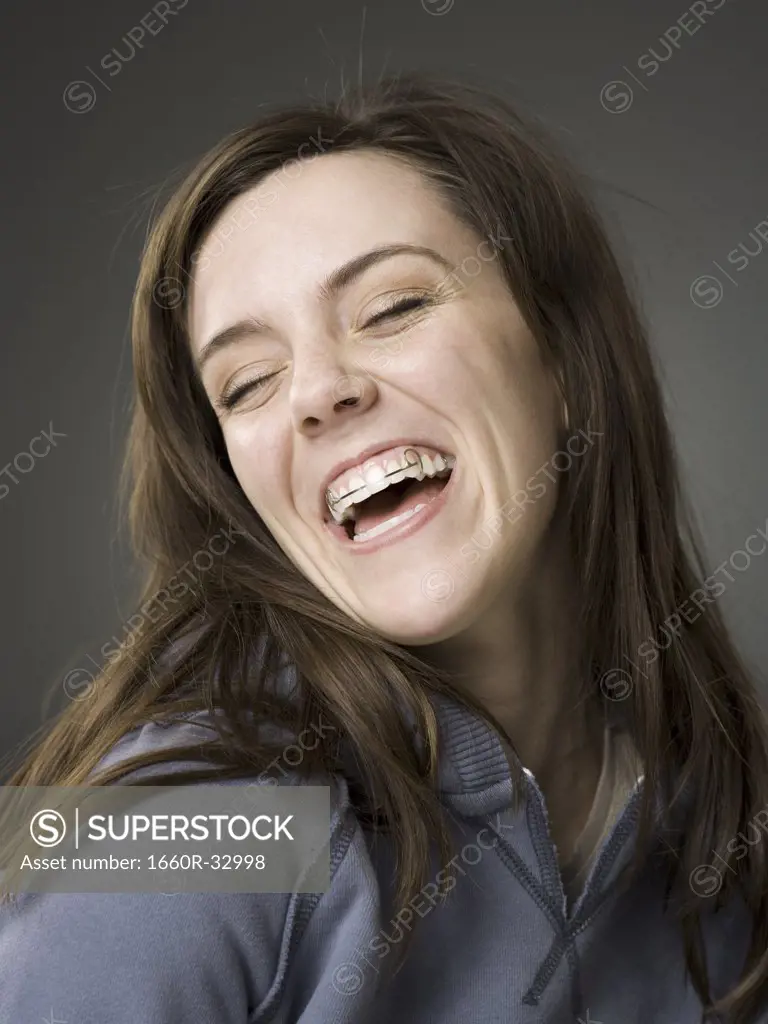 Woman smiling with dental retainer