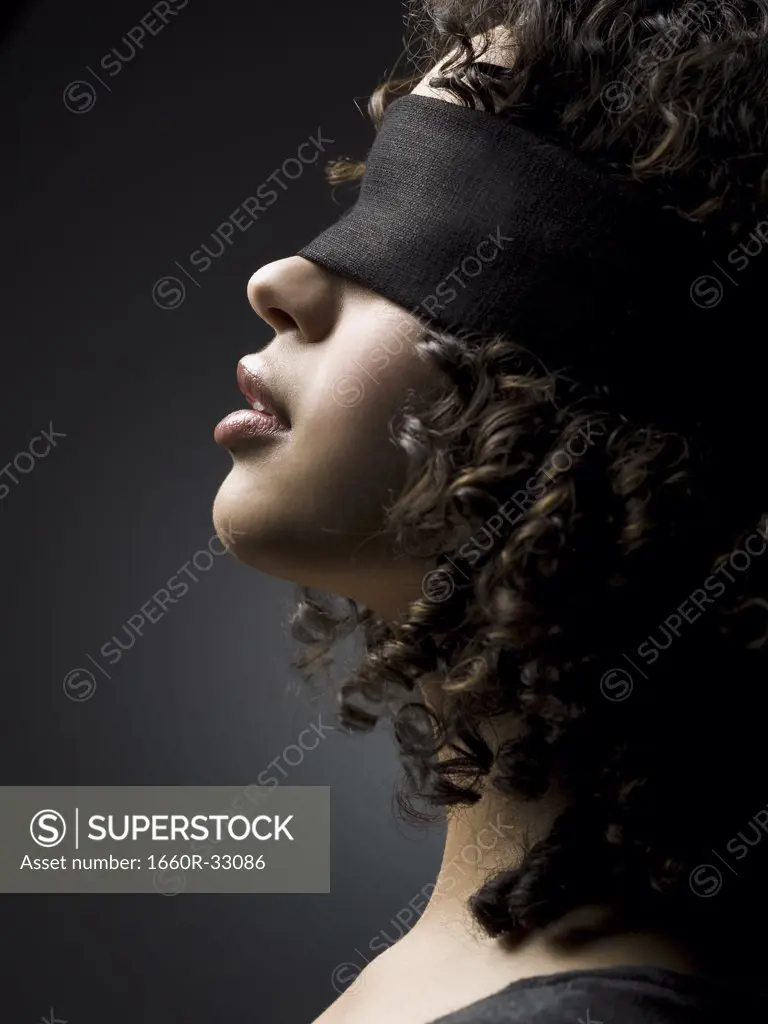 Profile of a blindfolded woman