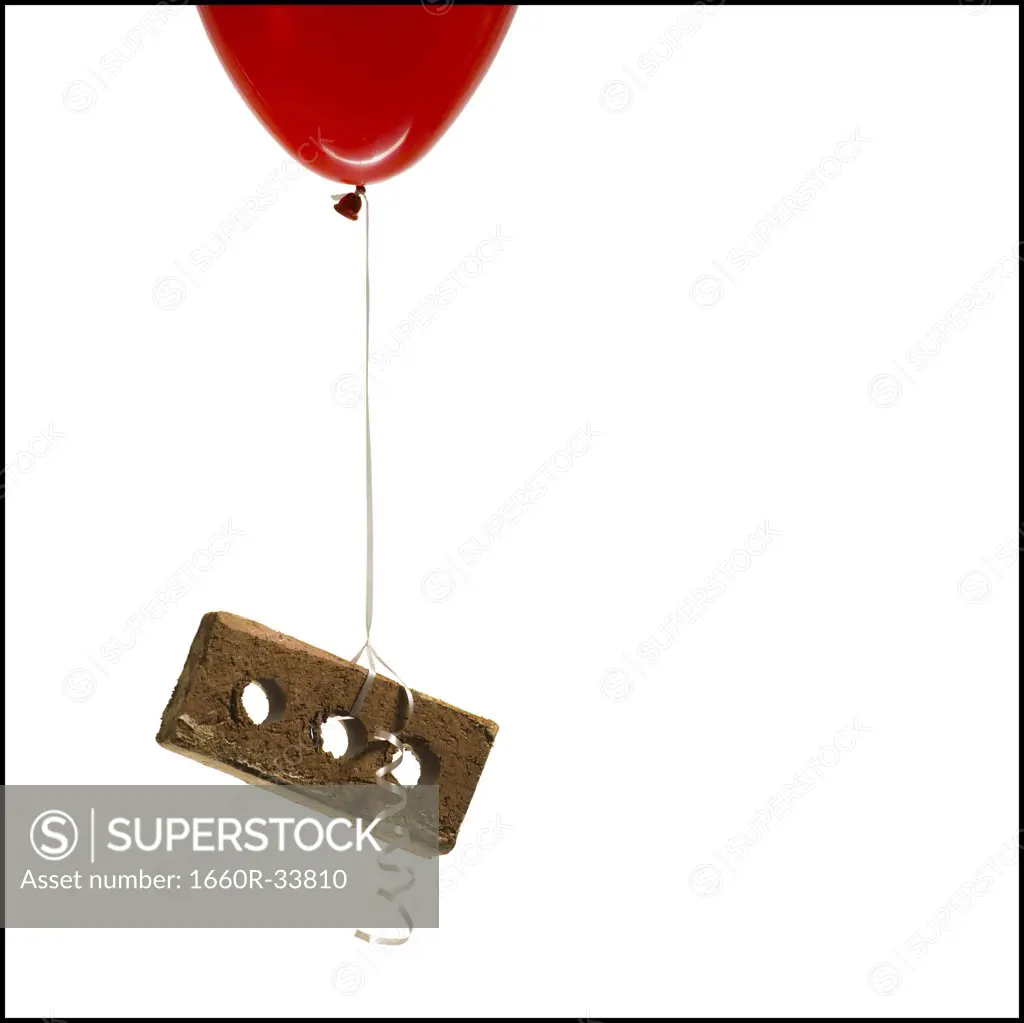 Helium balloon lifting brick