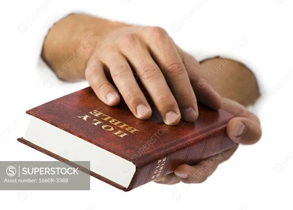 Close-up of hands holding the Bible