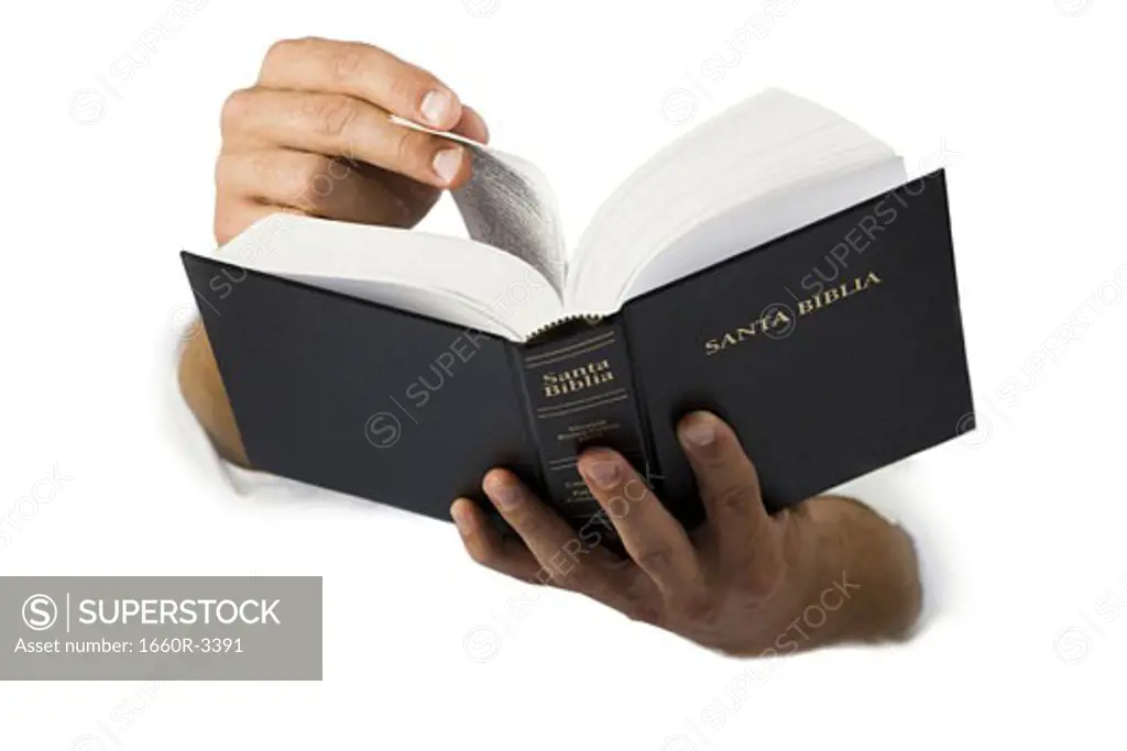 Close-up of  hands holding a Spanish language Bible