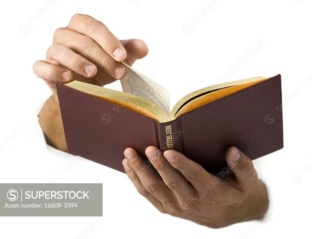 Close-up of hands holding a book