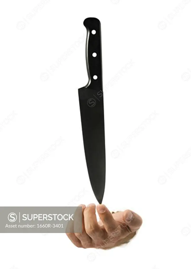 Close-up of a knife in a man's hand