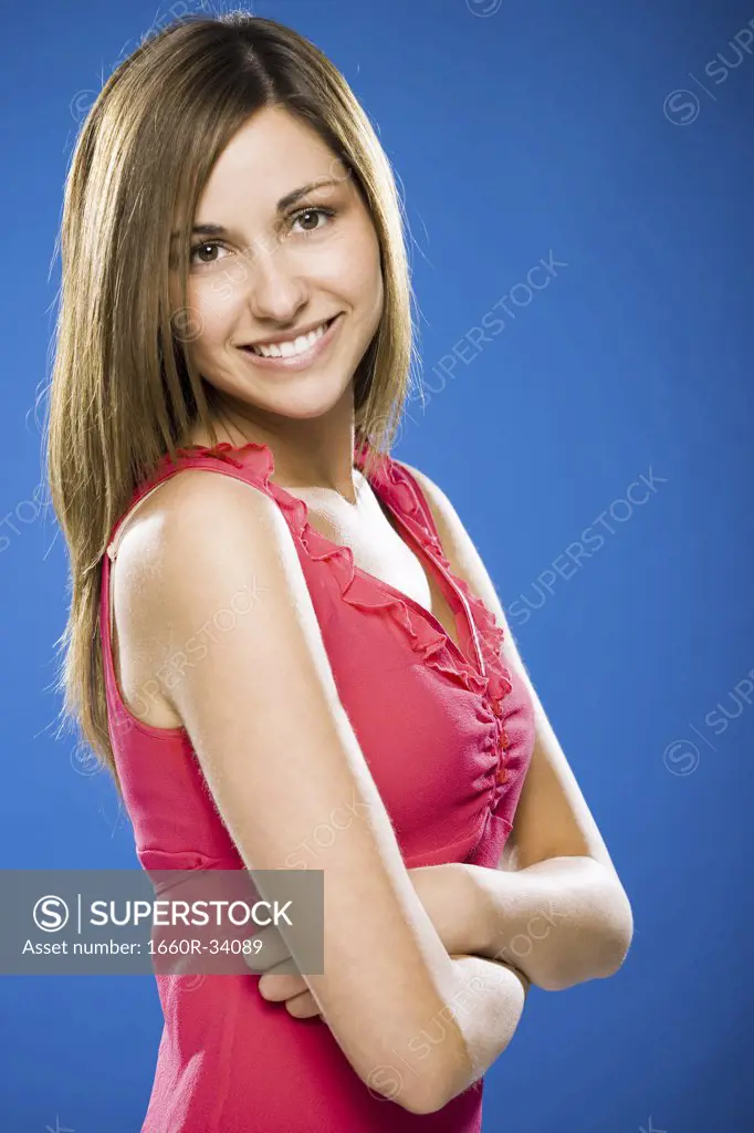 Woman smiling with arms crossed