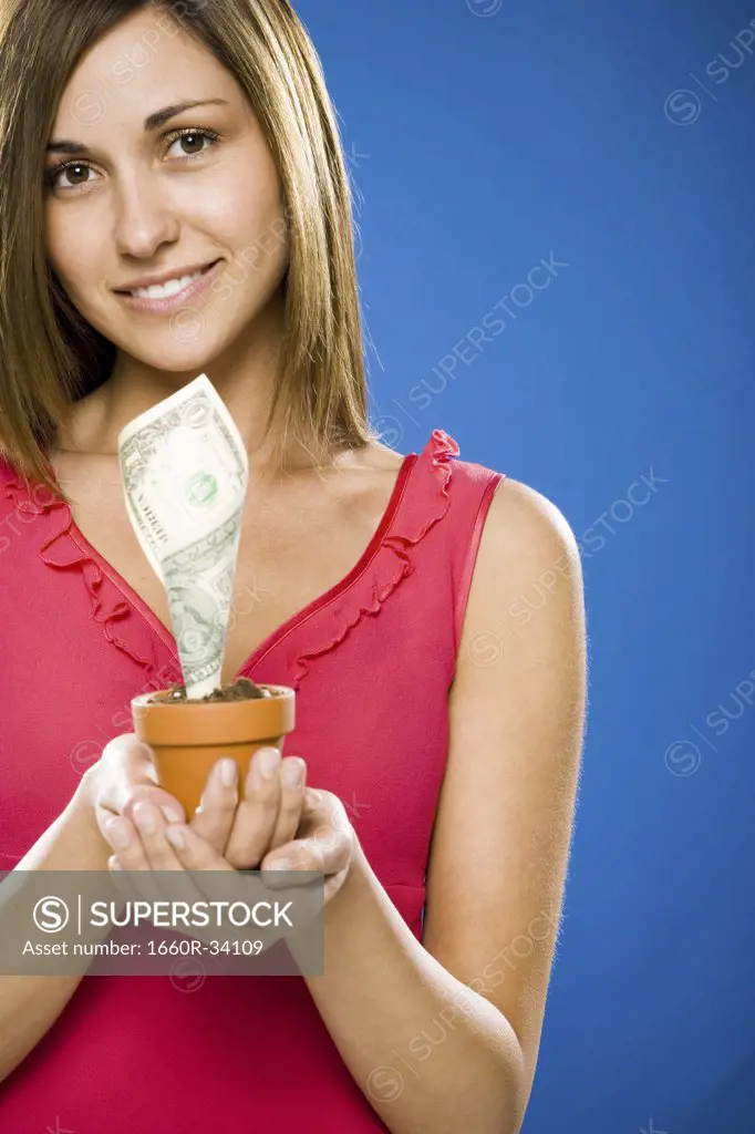 Woman holding euro money tree