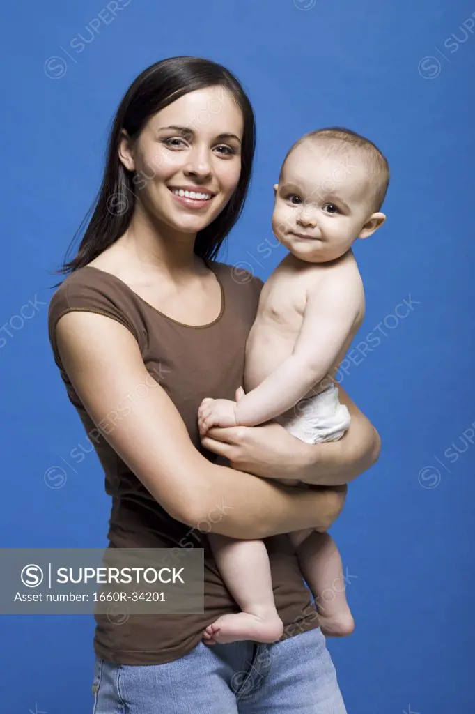 Woman holding baby smiling