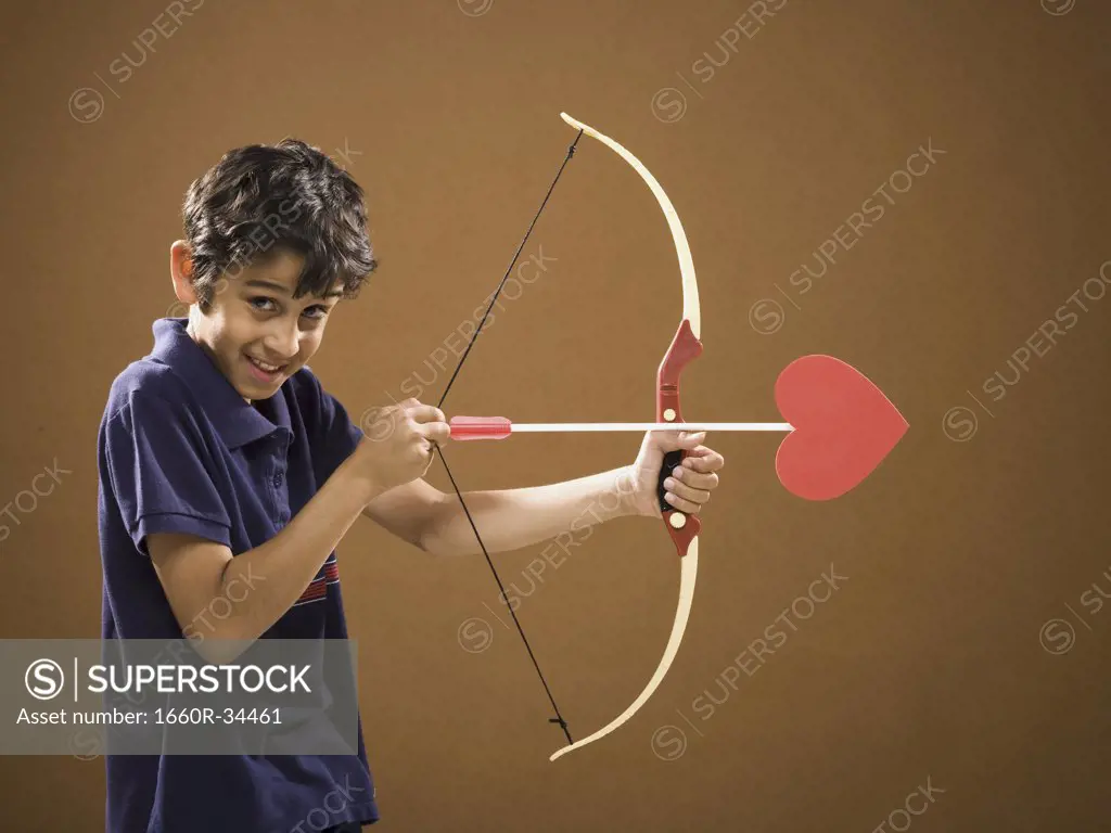 Boy with bow and arrow with heart on it