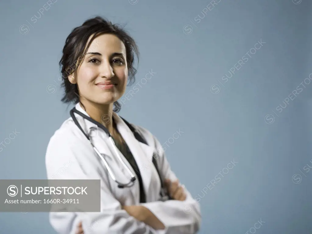 Female doctor with arms crossed smiling