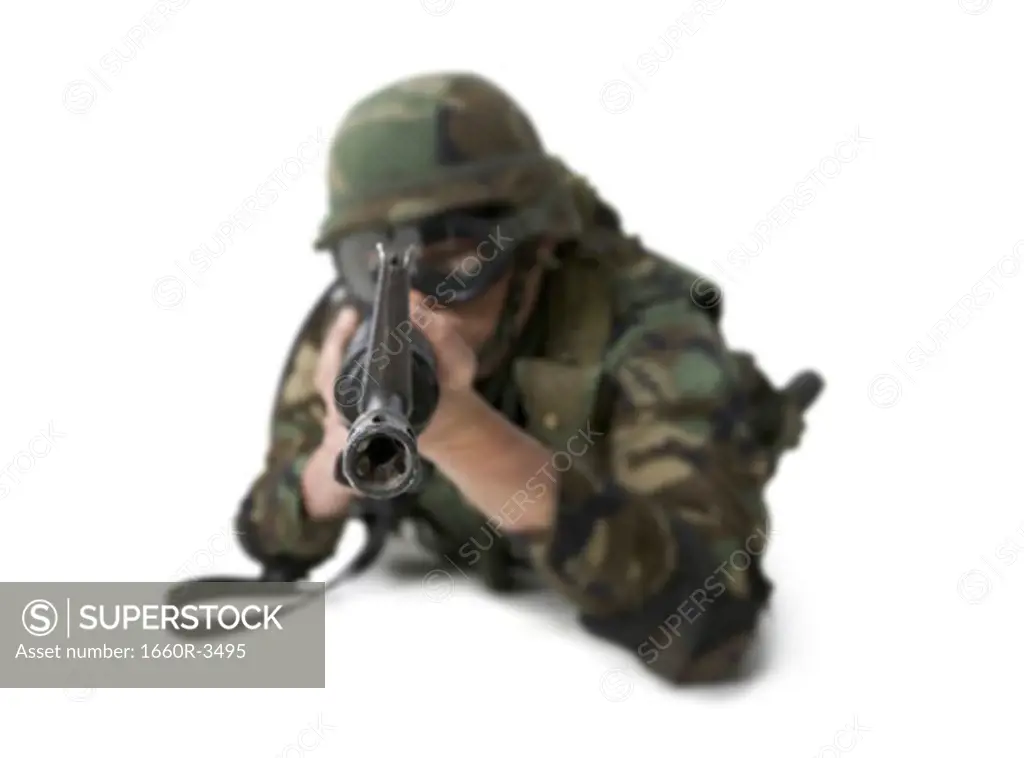 Close-up of a soldier with his gun