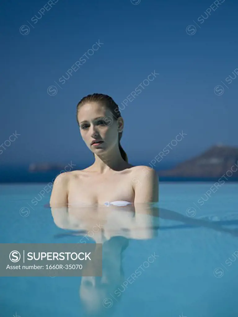 Woman in pool outdoors