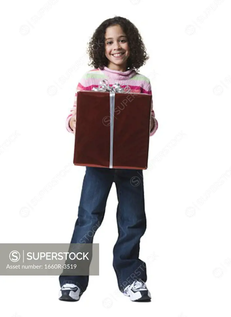 Portrait of a girl holding a gift box