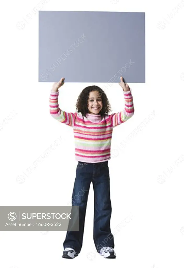Portrait of a girl holding a blank sign up of her head
