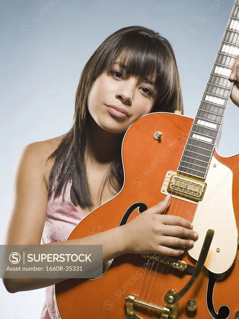 Woman playing guitar