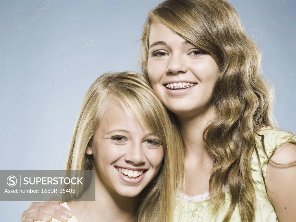 Two girls embracing and smiling
