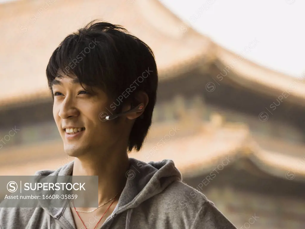 Closeup of teenage boy  with headset smiling
