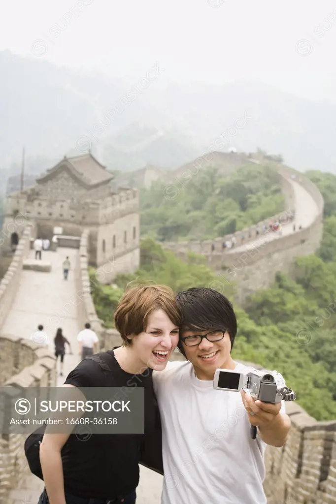 Young couple at the Great Wall of China.