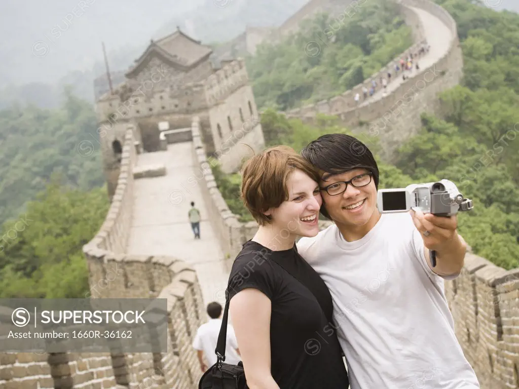 Young couple at the Great Wall of China.