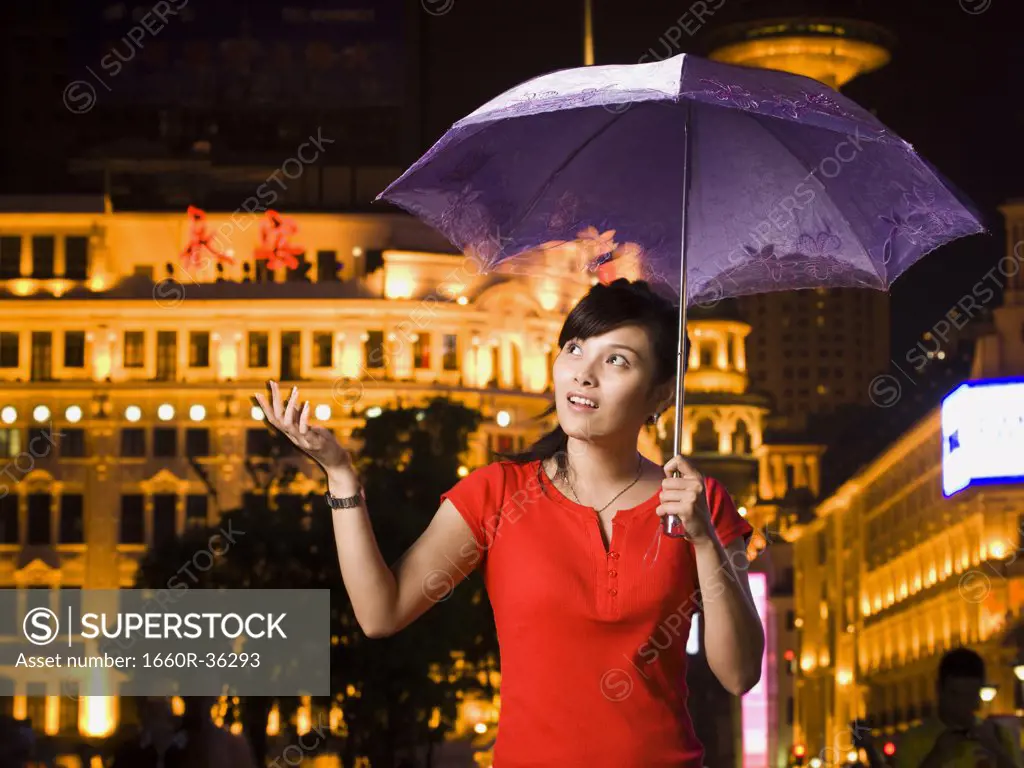 Young couple under an umbrella.