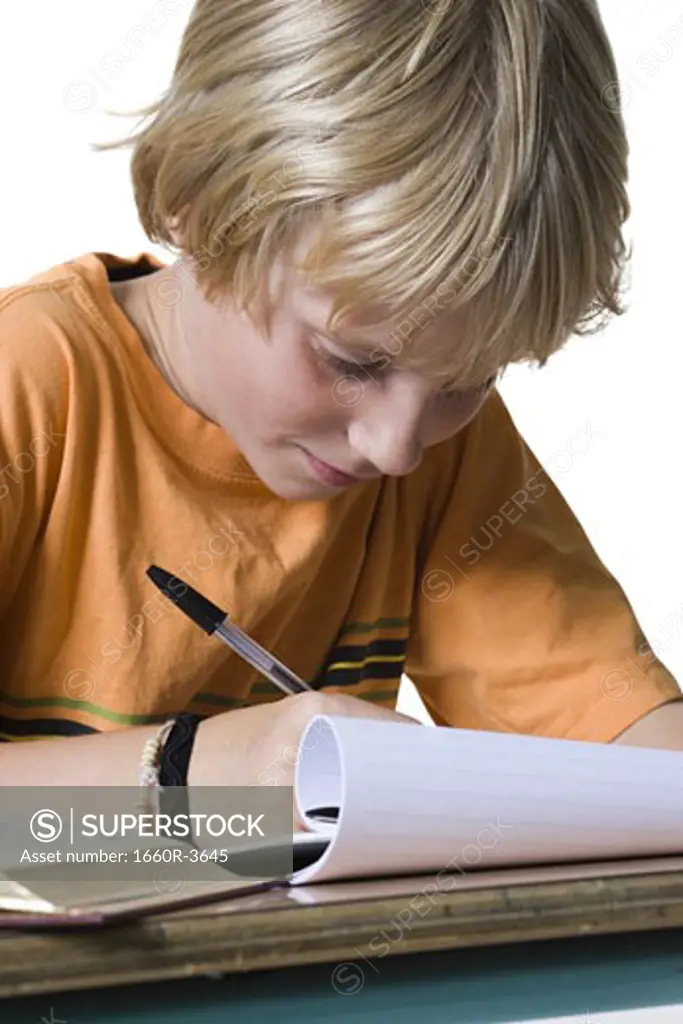 Close-up of a boy doing homework