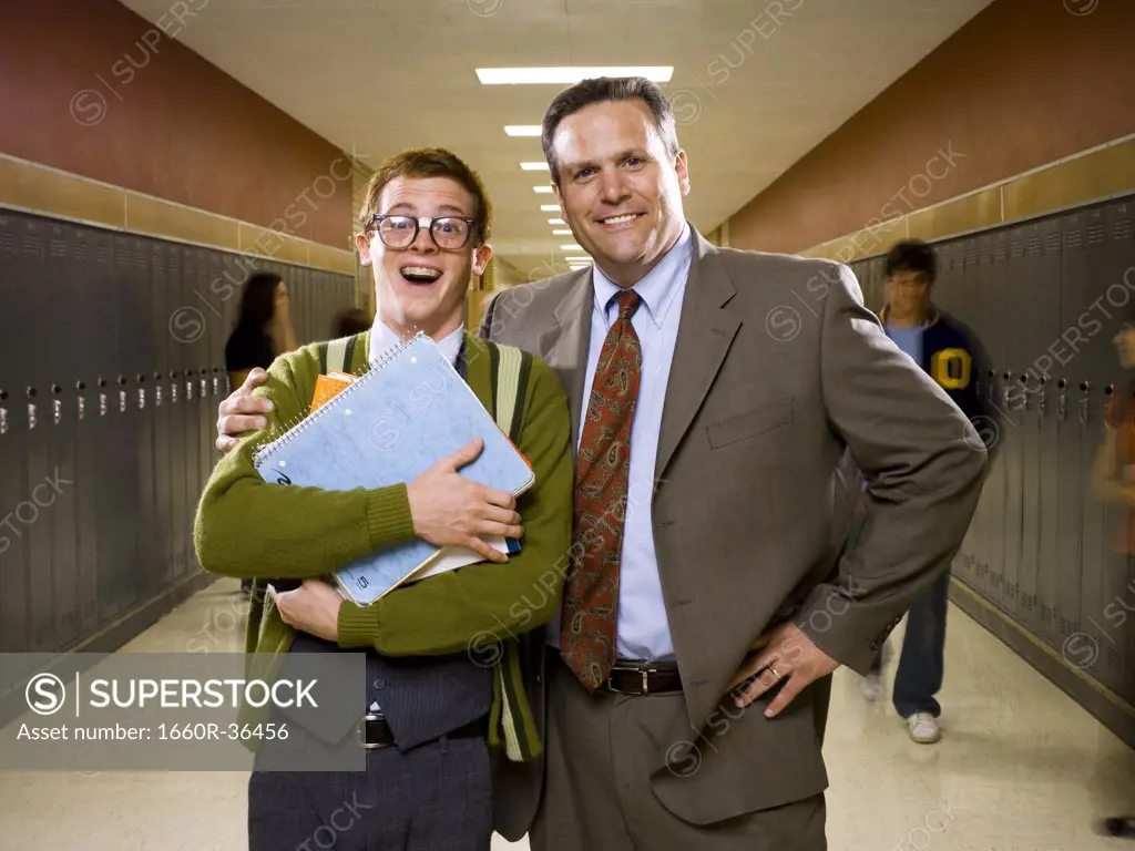 High School Principal stands with a student