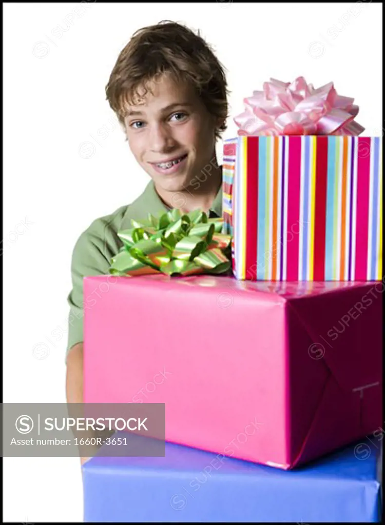 Portrait of a boy holding gifts