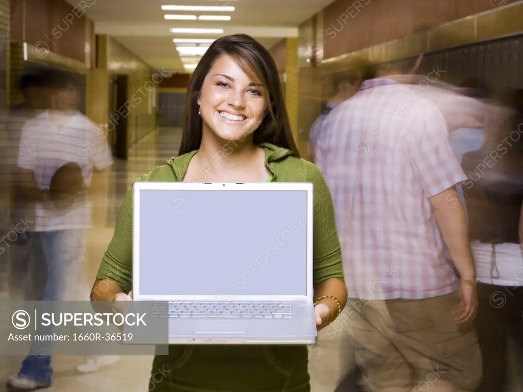 High School girl at school with a notebook computer.