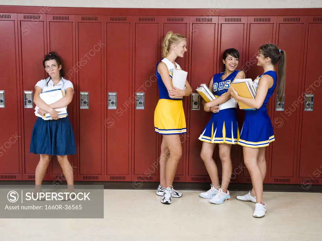 Two High School cheer leaders and a nerd.