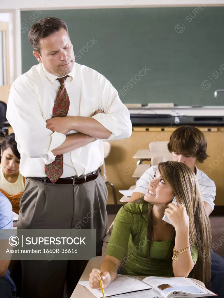 Student and teacher in a classroom.