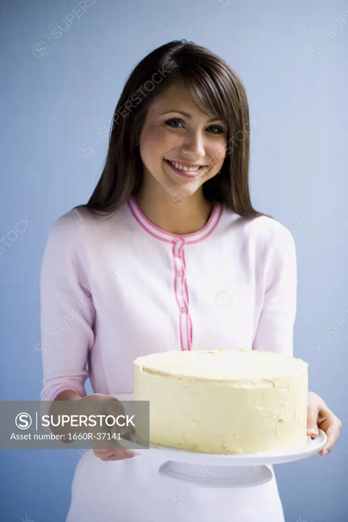 Young woman with a cake.