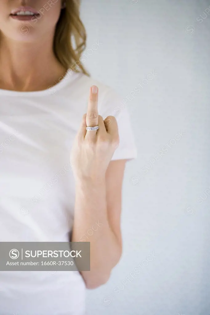 Woman holding up her wedding ring.