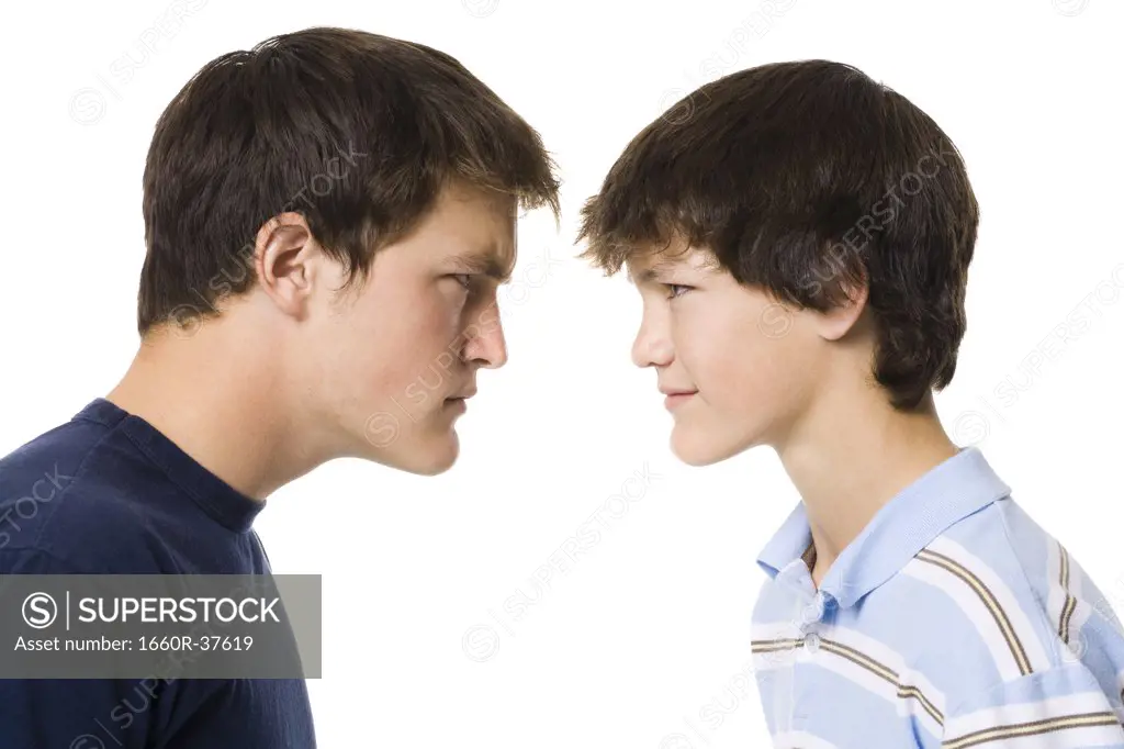 older boy and younger boy head to head.