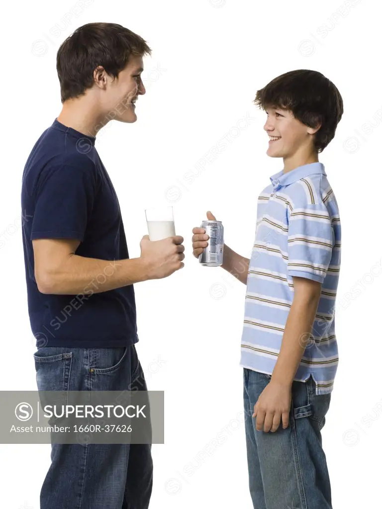 two young men drinking milk and soda.